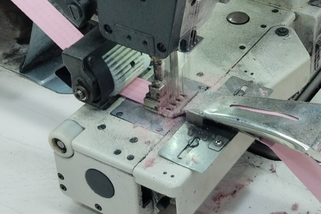 a strip of fabric being sewn